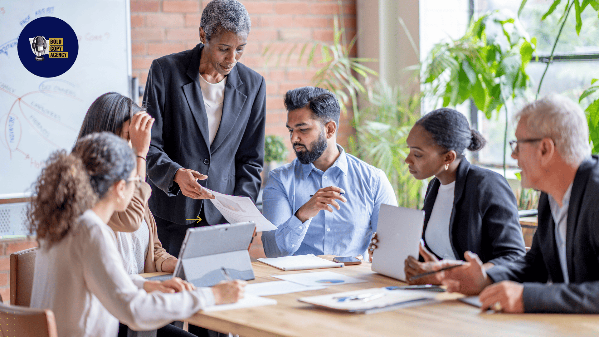 Russell Otway leads Bold Copy Agency team meeting on small business growth strategies and marketing planning for clients.